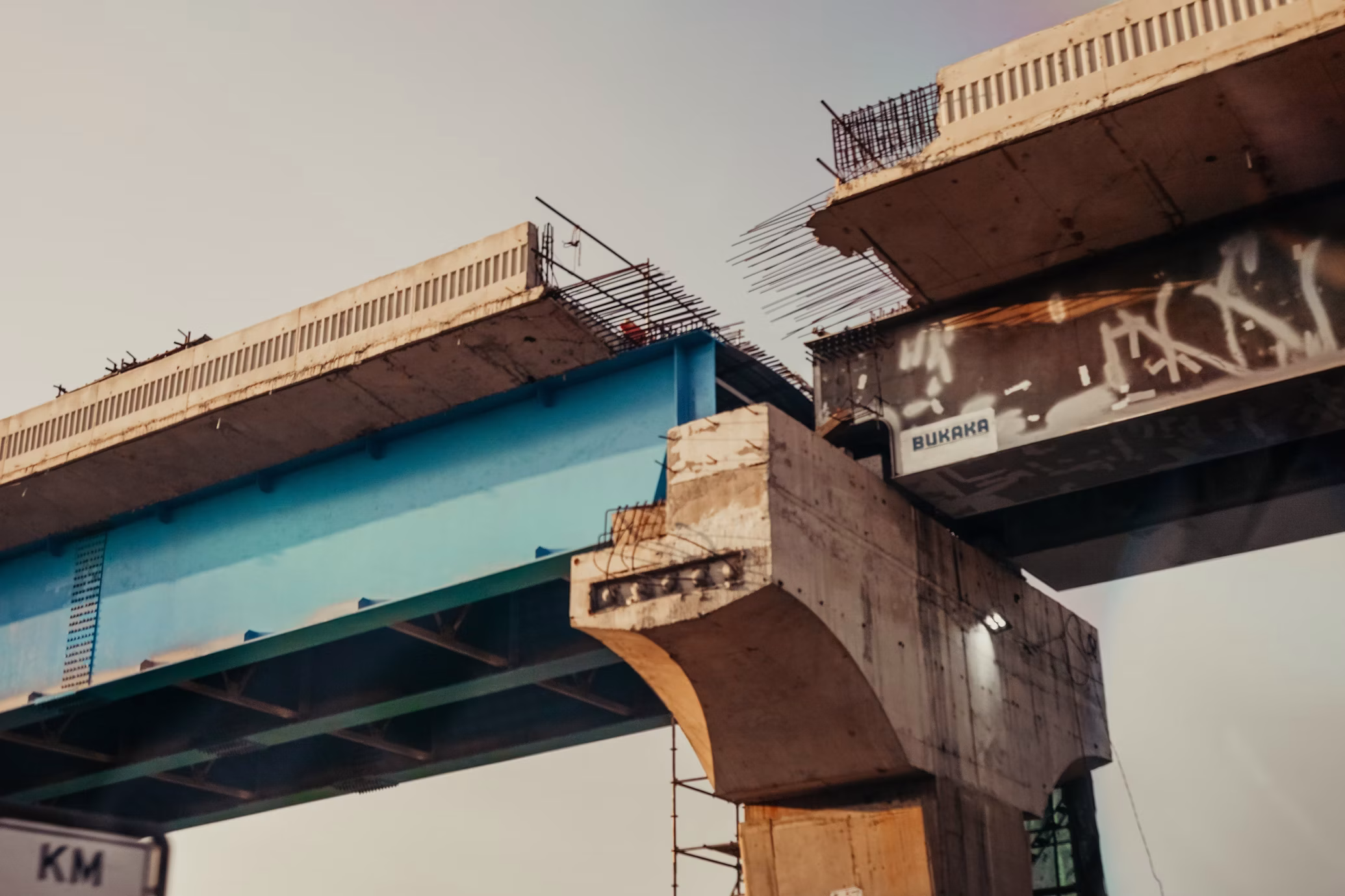 A concrete road bridge very close to completion, but getting old.