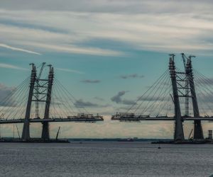 Photo of a bridge being built against a beautiful sky by Tatiana P on Unsplash