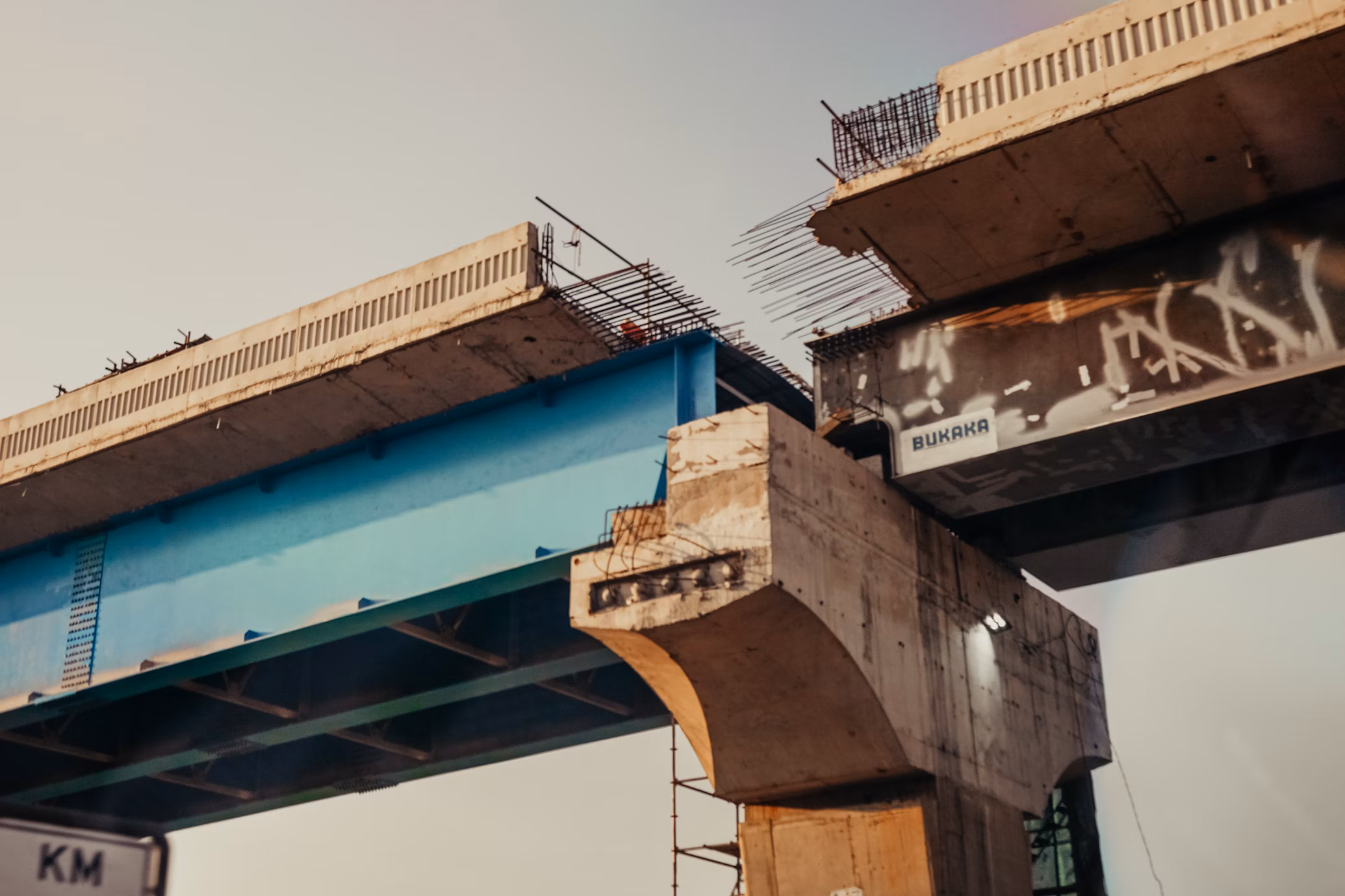A concrete road bridge very close to completion, but getting old.