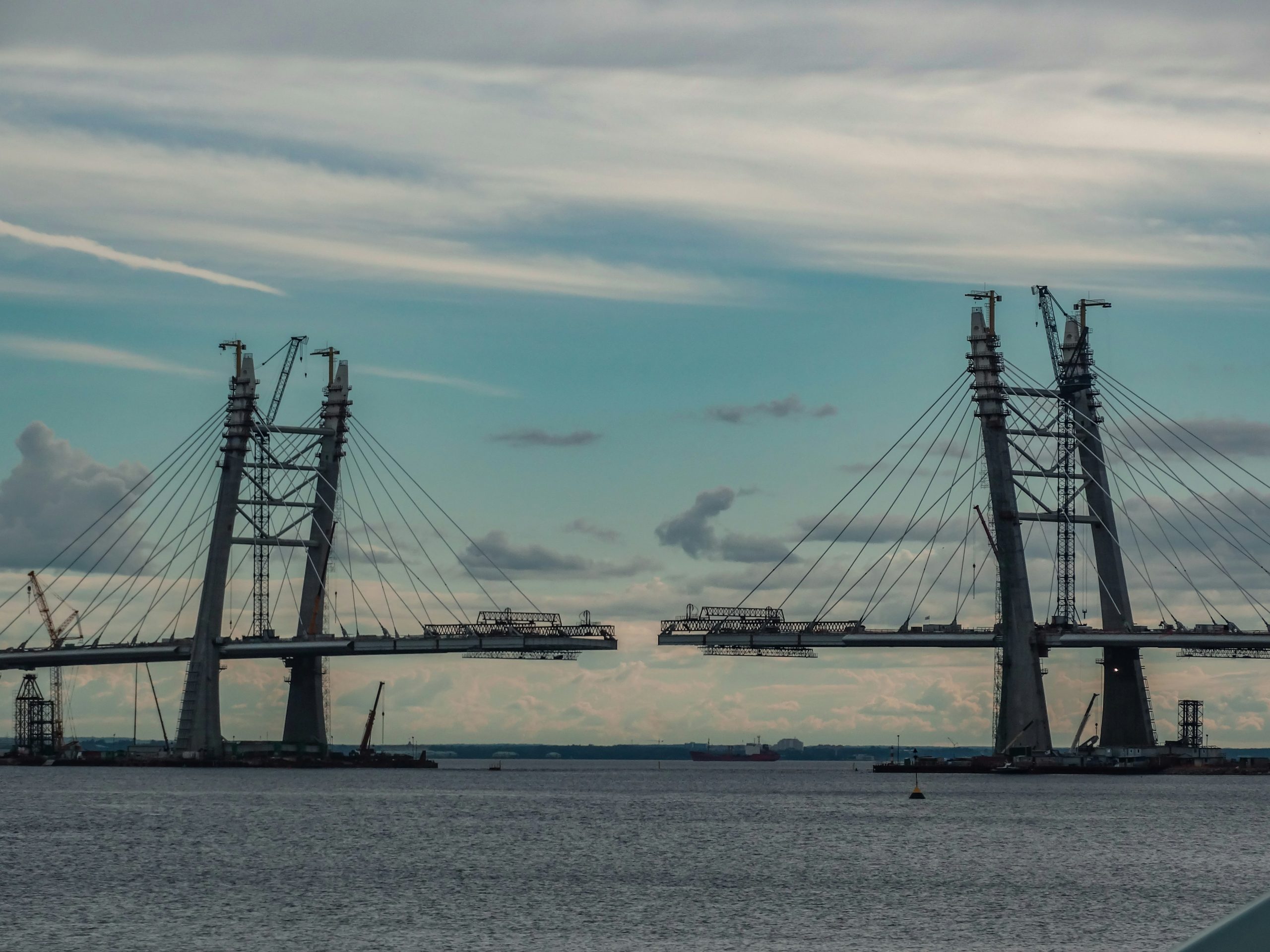 Photo of a bridge being built against a beautiful sky by Tatiana P on Unsplash